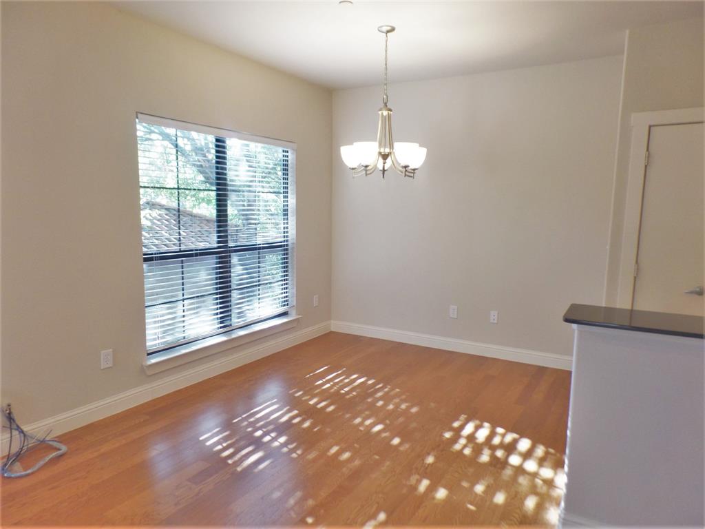 6159 Oram Street, Unit 105 Dallas, TX 75214 - Photo 5 of 16 a view of an empty room with a window