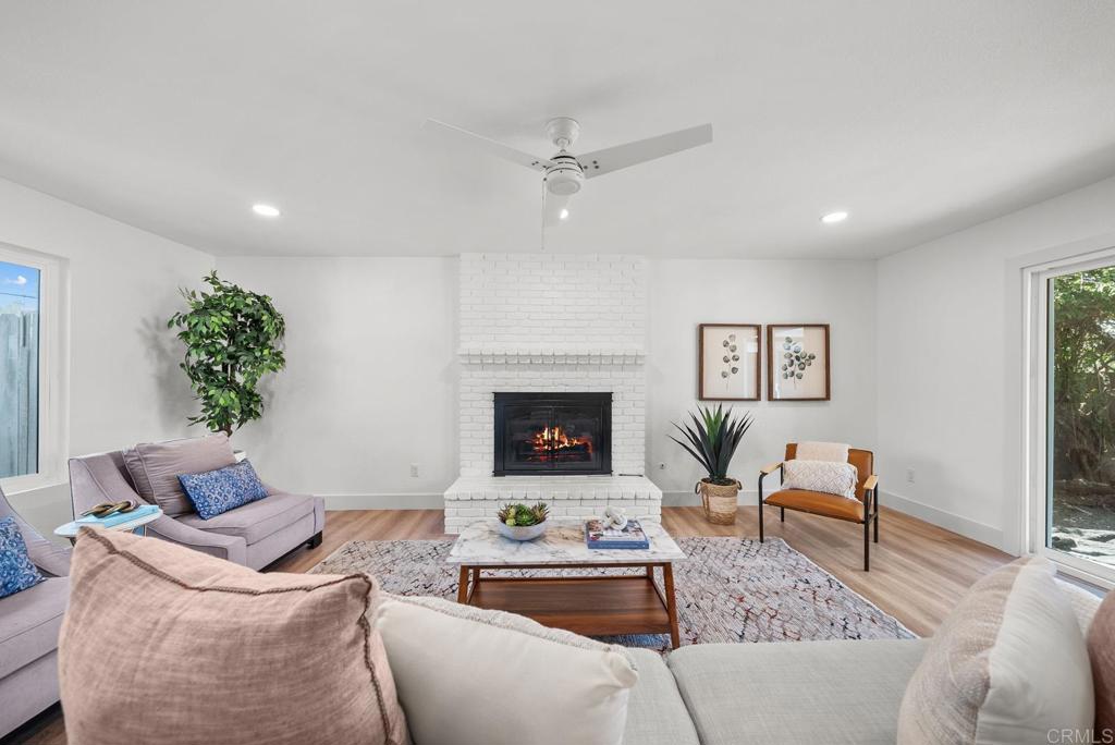 9306 Hollyhock Lane Spring Valley, CA 91977 - Photo 13 of 61 a living room with furniture and a fireplace