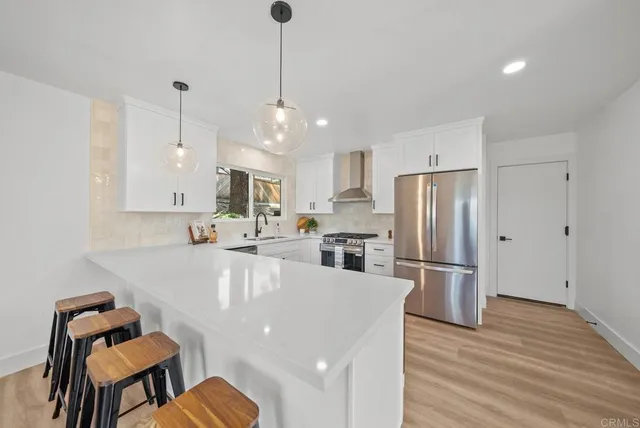 a living room with a bed furniture and a window
