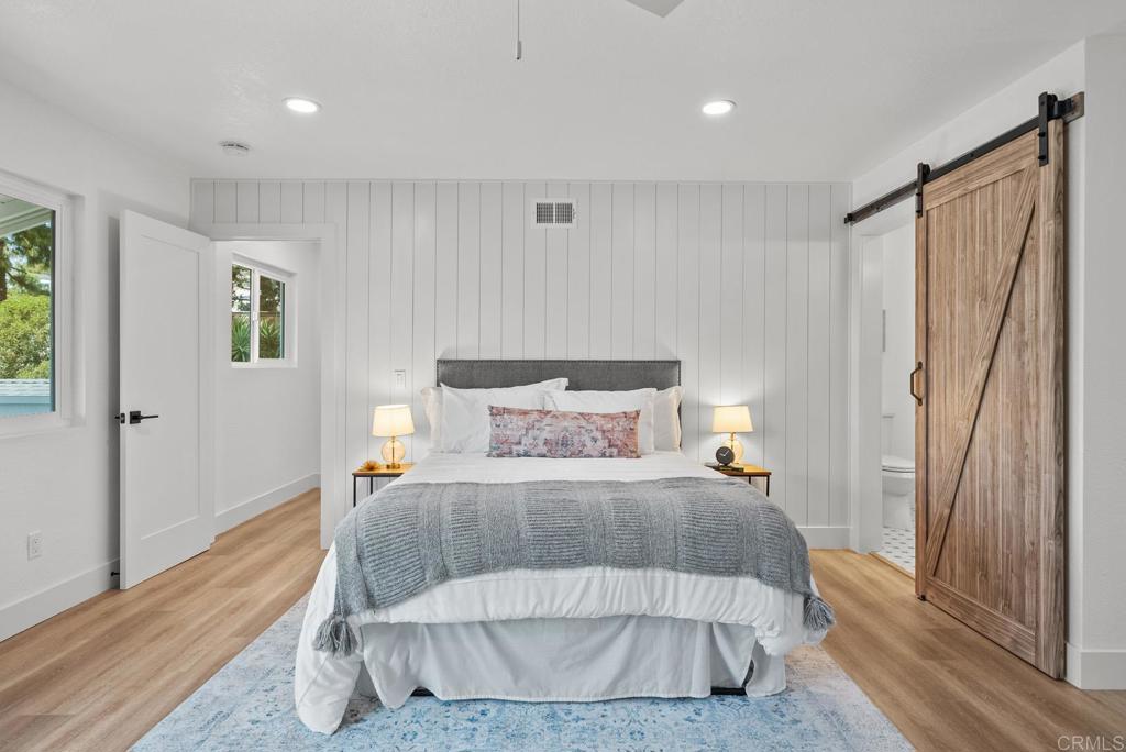 9306 Hollyhock Lane Spring Valley, CA 91977 - Photo 41 of 61 a bedroom with a bed and a mirror