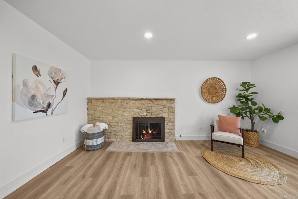 9306 Hollyhock Lane Spring Valley, CA 91977 - Photo 42 of 61 a living room with furniture and a fireplace