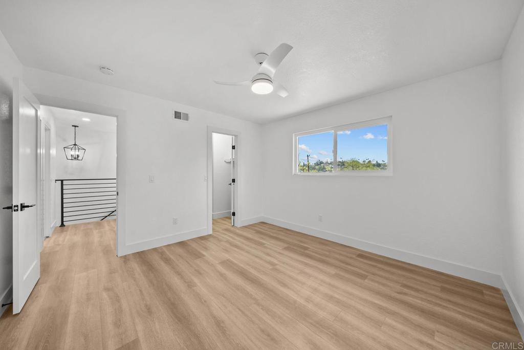 9306 Hollyhock Lane Spring Valley, CA 91977 - Photo 55 of 61 a view of an empty room with wooden floor