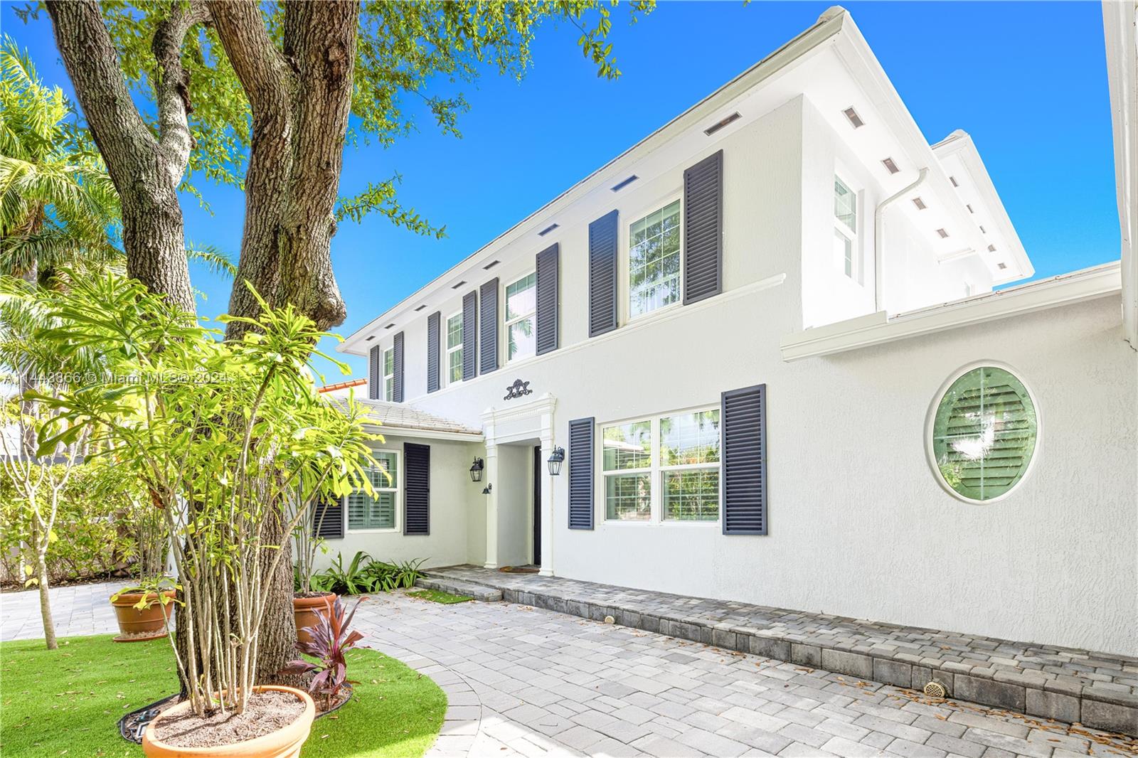 4531 North Bay Road Miami Beach, FL 33140 - Photo 2 of 40 a front view of a house with garden