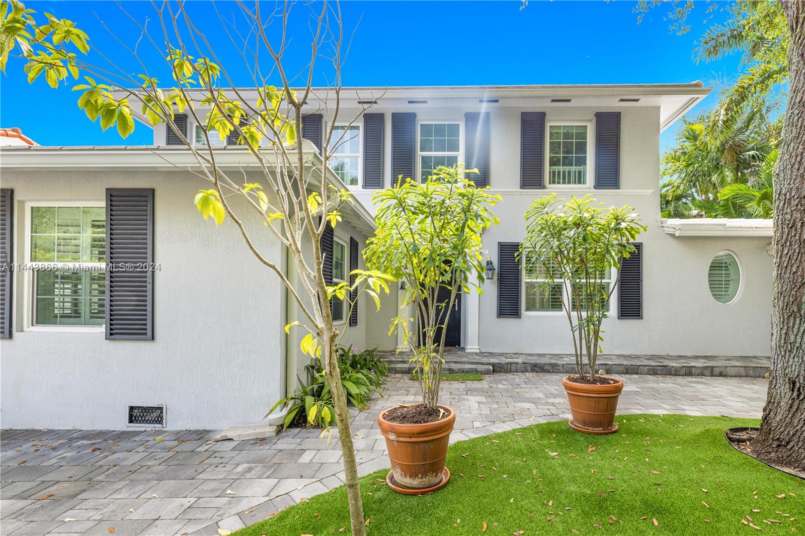 4531 North Bay Road Miami Beach, FL 33140 - Photo 3 of 40 a front view of a house with garden