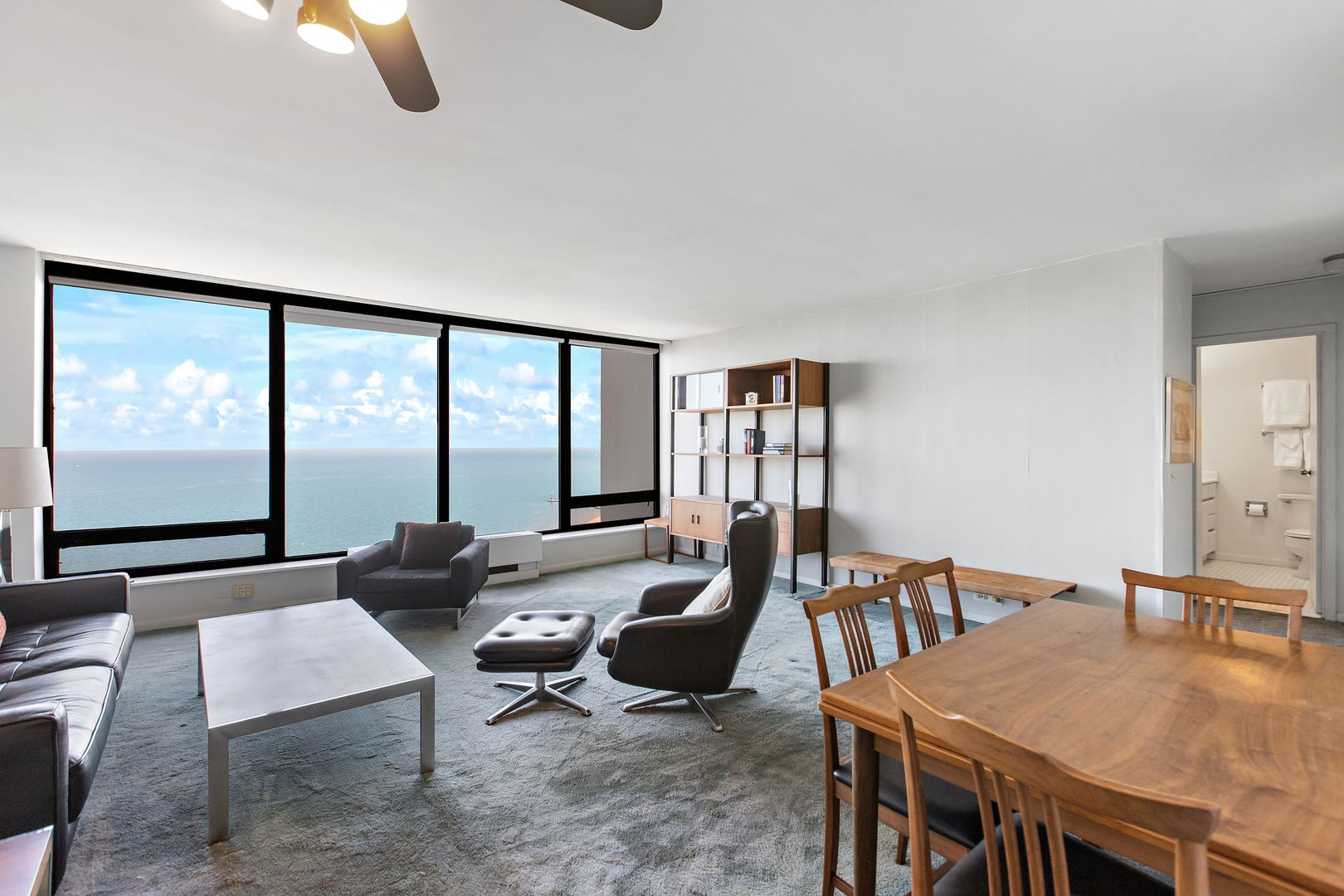 5445 North Sheridan Road, Unit 2810 Chicago, IL 60640 - Photo 3 of 17 a living room with furniture and a large window
