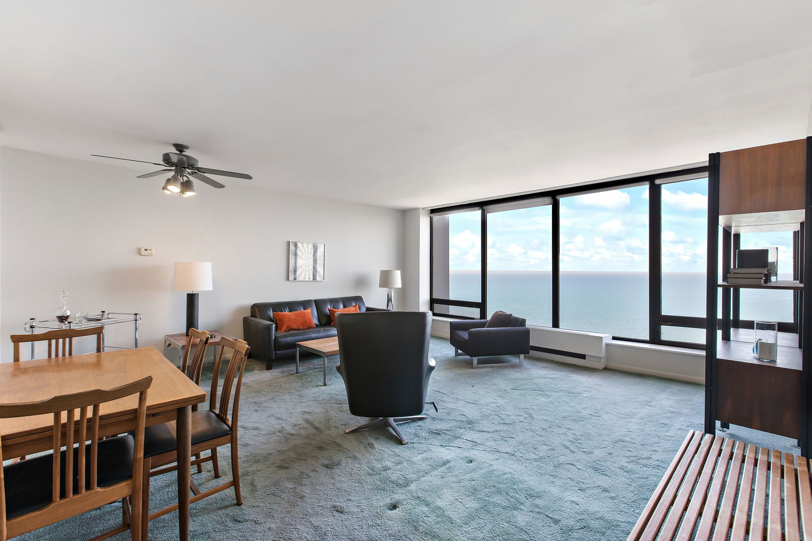 5445 North Sheridan Road, Unit 2810 Chicago, IL 60640 - Photo 4 of 17 a living room with furniture and a floor to ceiling window