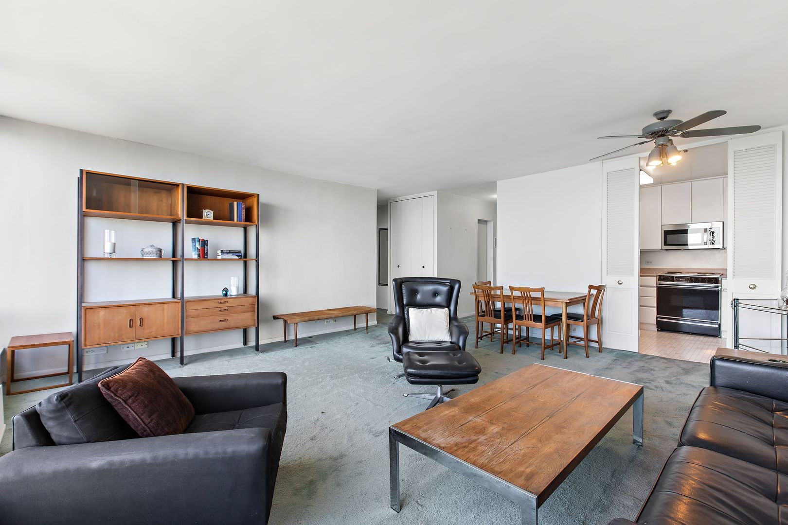 5445 North Sheridan Road, Unit 2810 Chicago, IL 60640 - Photo 6 of 17 a living room with furniture a dining table and a fireplace