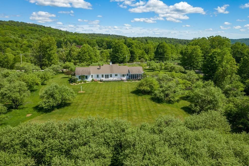 411 West Leyden Road Leyden, MA 01337 - Photo 1 of 42 a view of a garden with a building in the background
