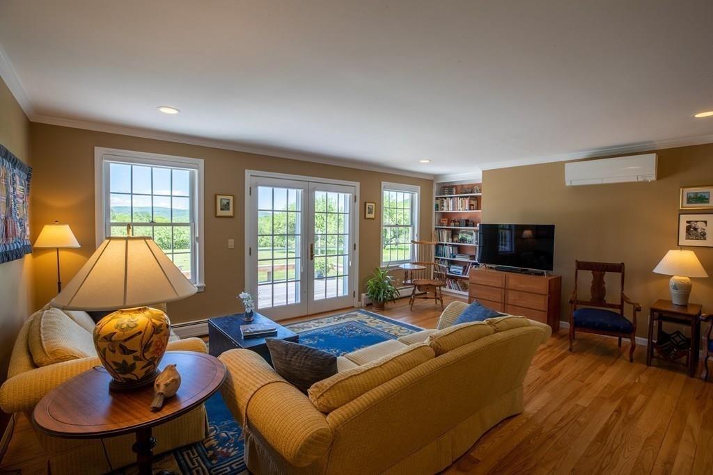 411 West Leyden Road Leyden, MA 01337 - Photo 11 of 42 a living room with furniture and a flat screen tv