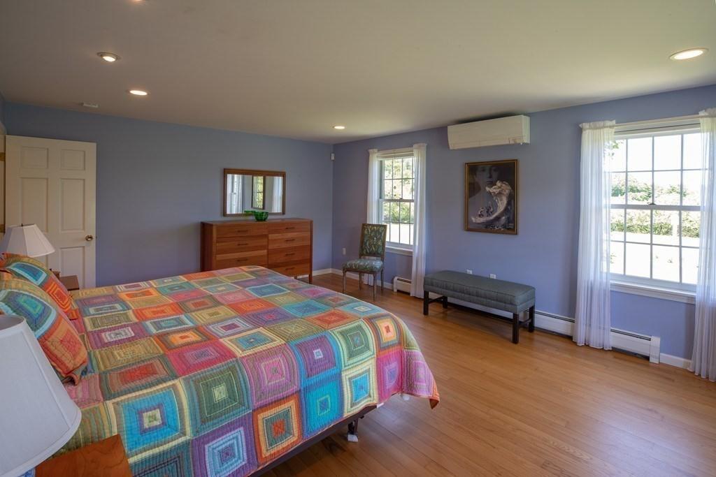 411 West Leyden Road Leyden, MA 01337 - Photo 23 of 42 a bedroom with a bed and wooden floor