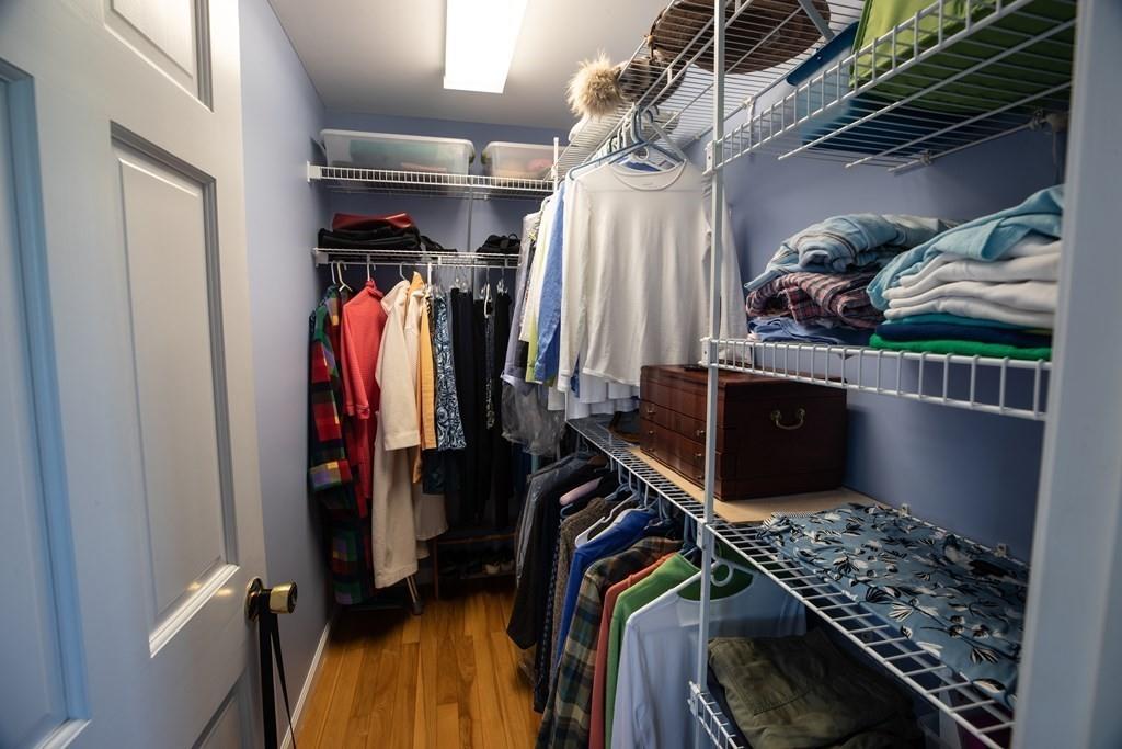 411 West Leyden Road Leyden, MA 01337 - Photo 25 of 42 a view of walk in closet with clothes and shoes
