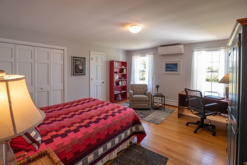 411 West Leyden Road Leyden, MA 01337 - Photo 28 of 42 a bedroom with a bed a chair and a large window