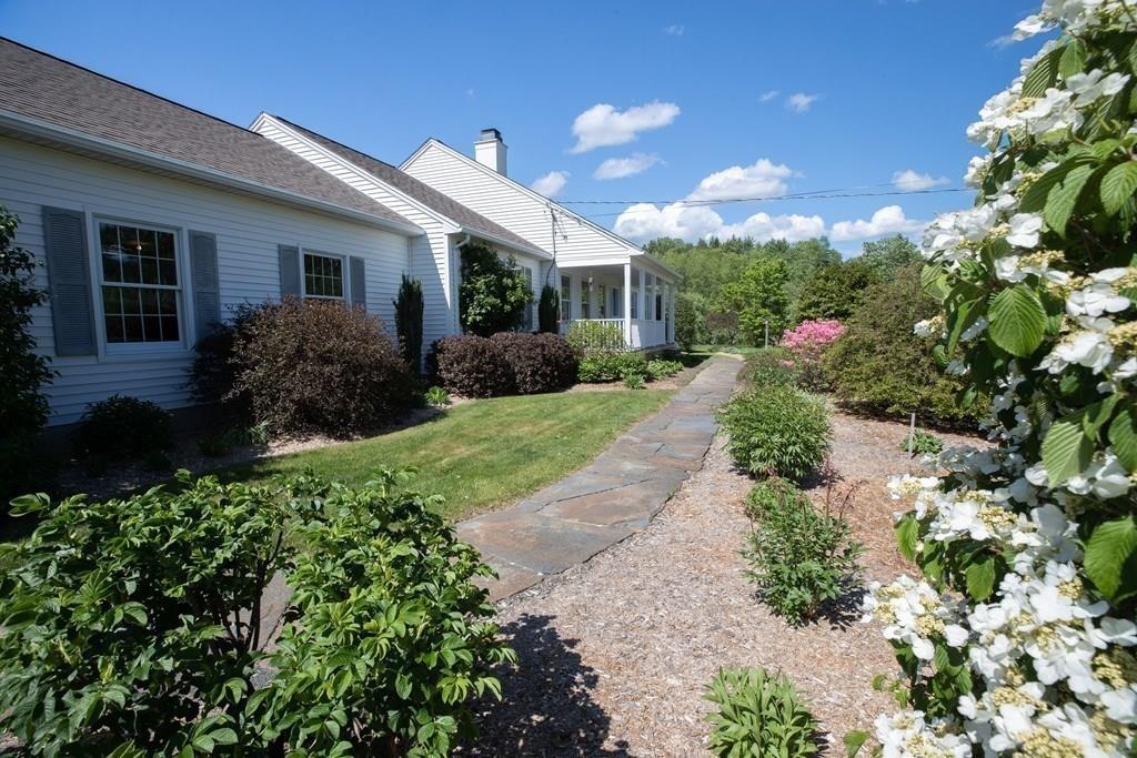 411 West Leyden Road Leyden, MA 01337 - Photo 8 of 42 a view of a house with garden and pathway