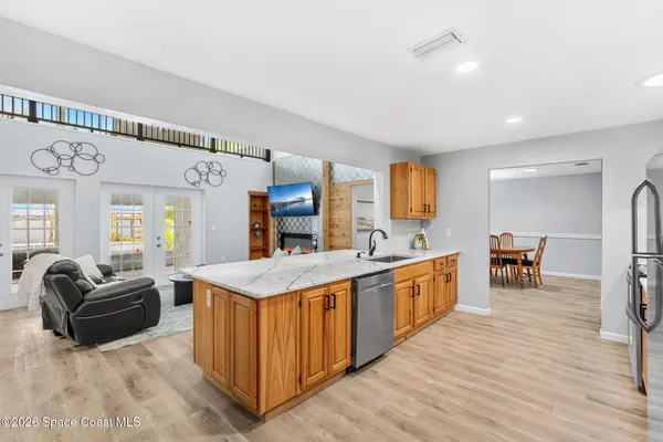 a view of a dining room with furniture and wooden floor