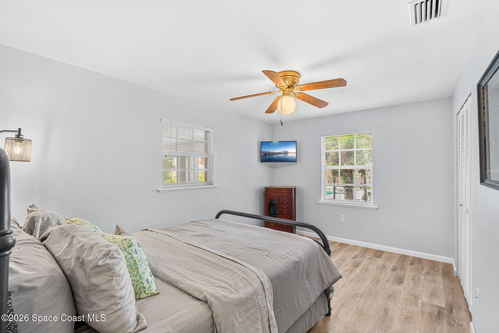 975 Oak Street Merritt Island, FL 32953 - Photo 33 of 76 a bedroom with a bed and a window