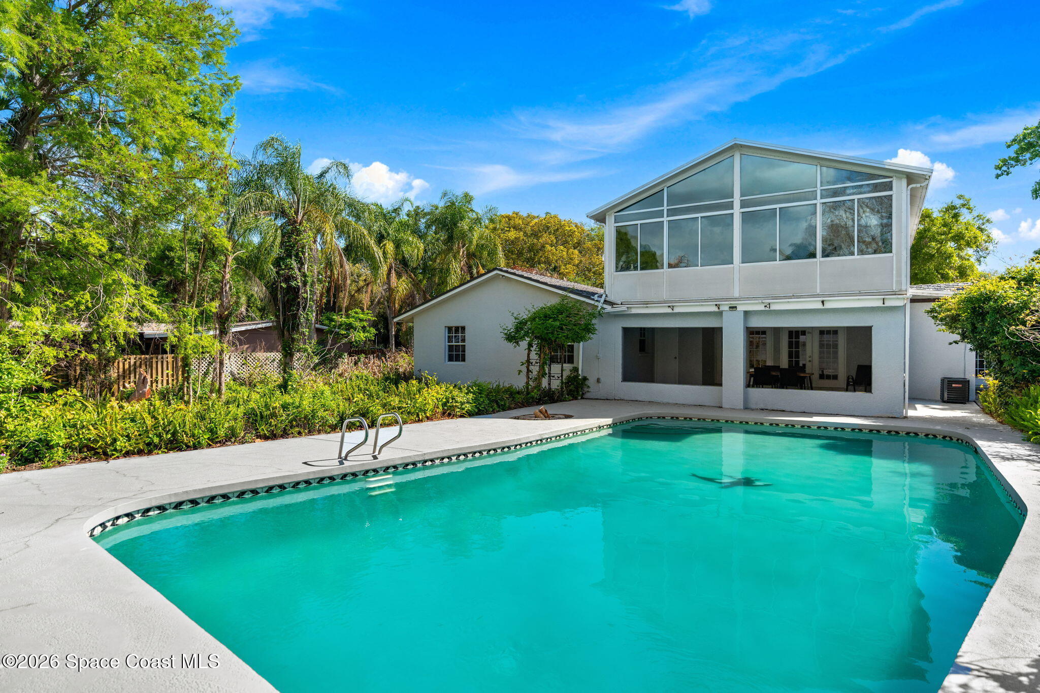 975 Oak Street Merritt Island, FL 32953 - Photo 45 of 76 a front view of a house with a yard