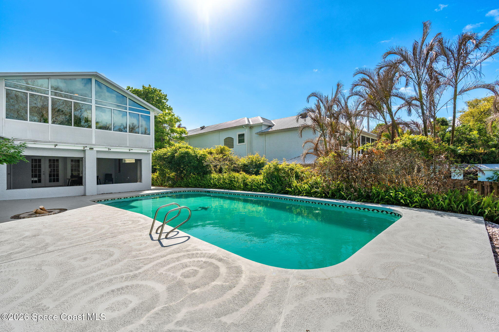 975 Oak Street Merritt Island, FL 32953 - Photo 46 of 76 a view of a swimming pool with a garden