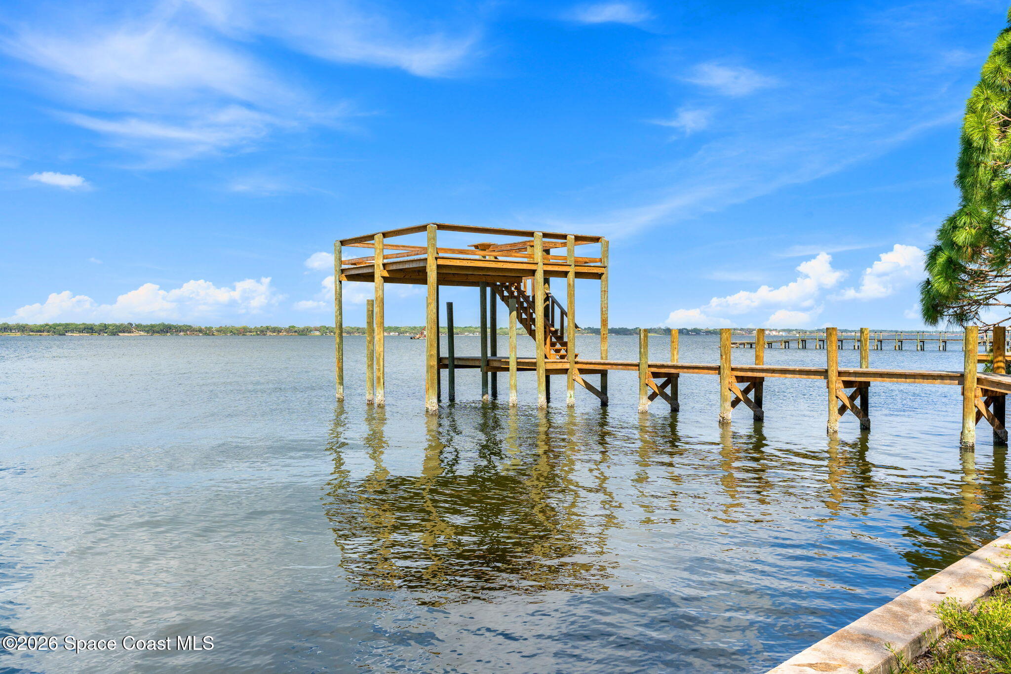 975 Oak Street Merritt Island, FL 32953 - Photo 61 of 76 a front view of a house with lake view