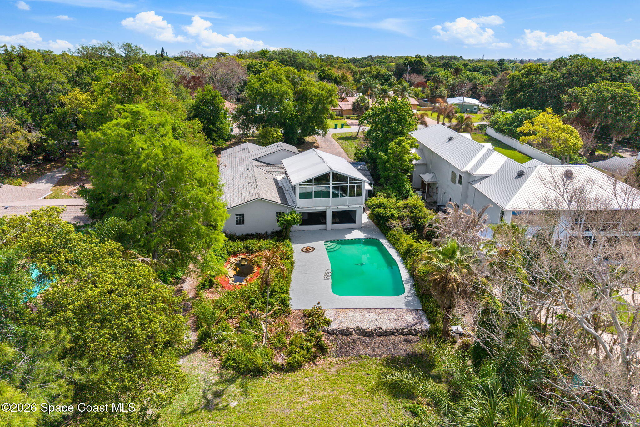 975 Oak Street Merritt Island, FL 32953 - Photo 66 of 76 an aerial view of a house with a garden