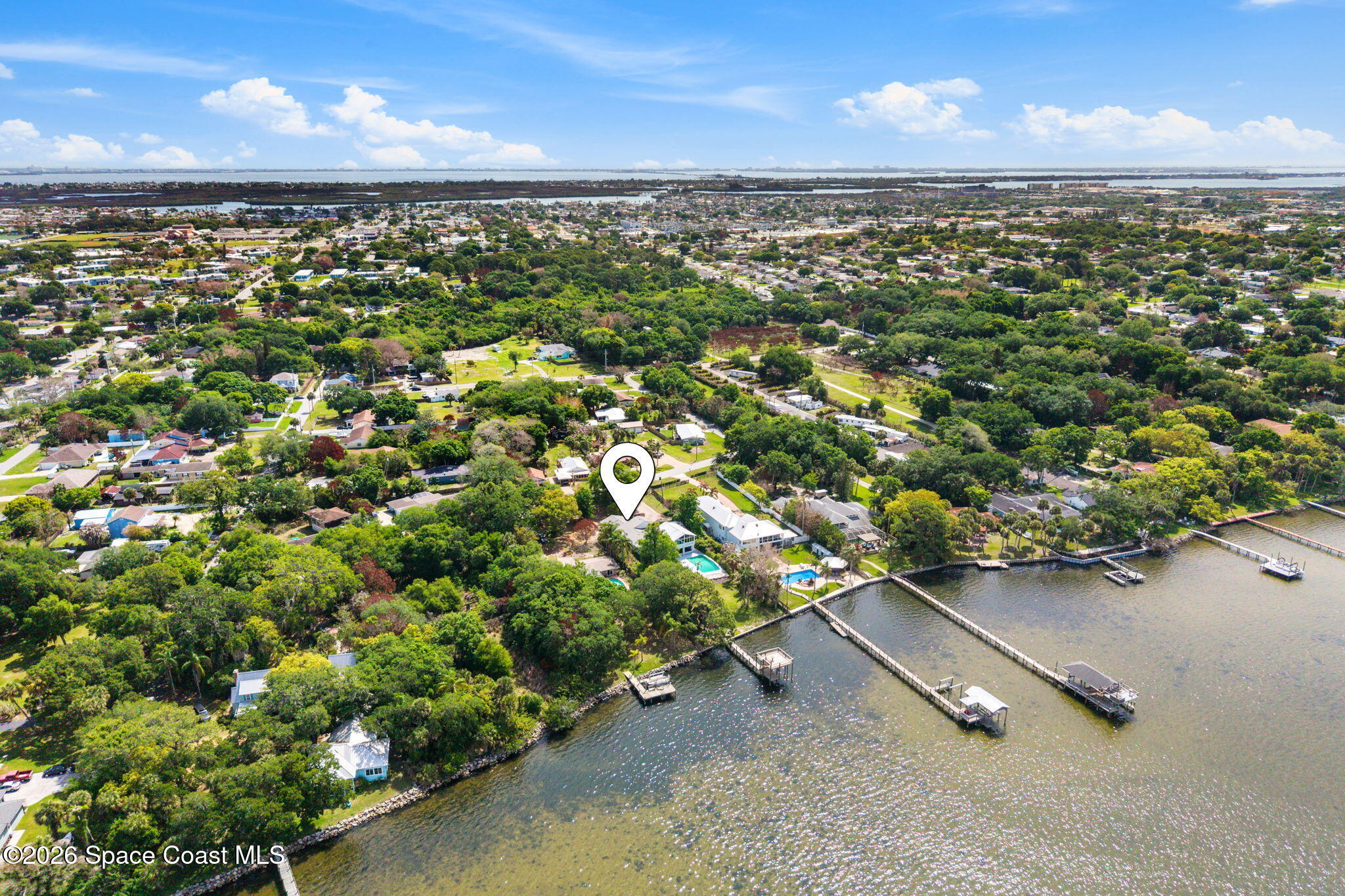 975 Oak Street Merritt Island, FL 32953 - Photo 68 of 76 an aerial view of a residential houses with outdoor space and street view