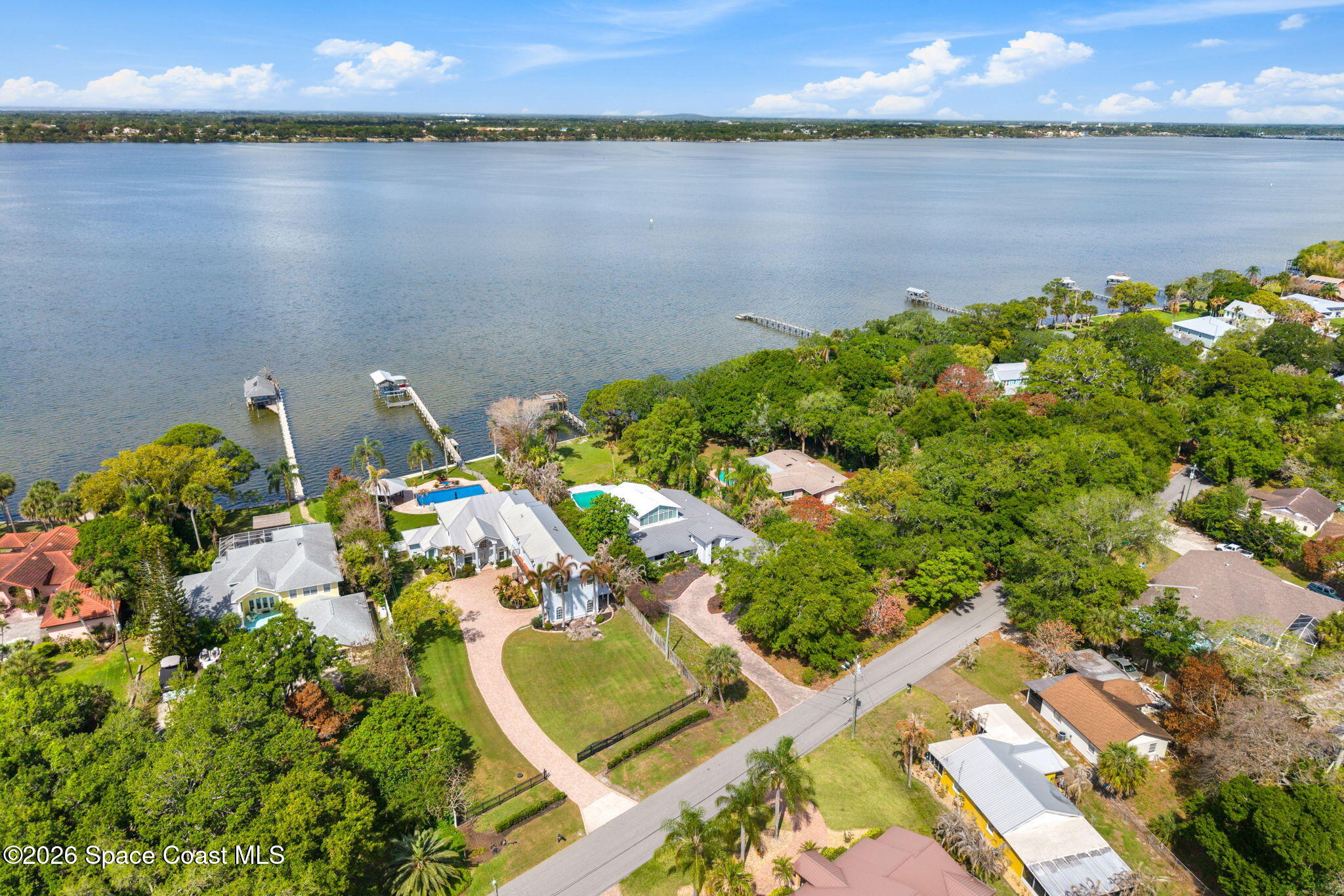 975 Oak Street Merritt Island, FL 32953 - Photo 74 of 76 a aerial view of a house with a lake view