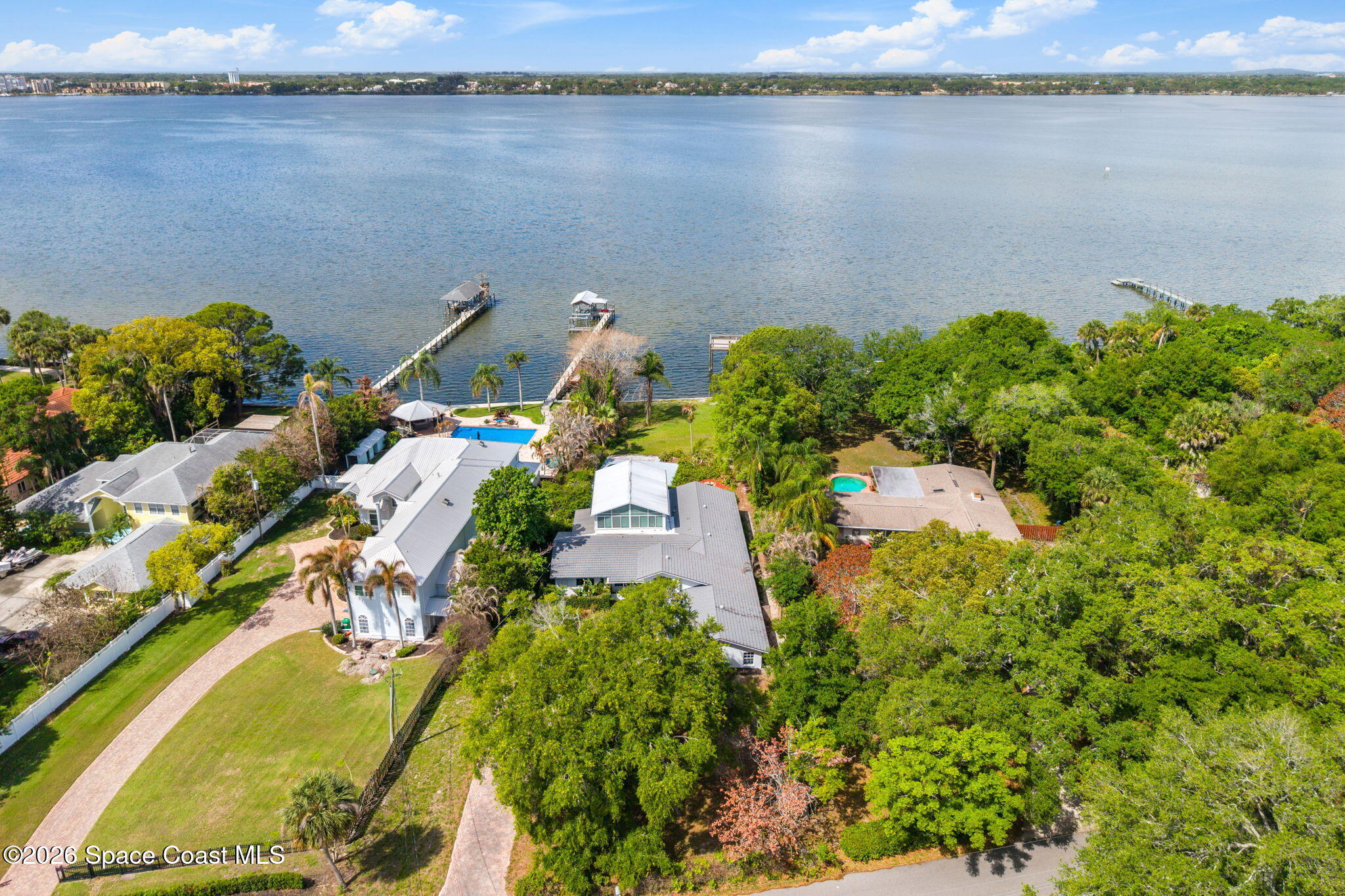 975 Oak Street Merritt Island, FL 32953 - Photo 75 of 76 an aerial view of a residential houses with outdoor space and lake view