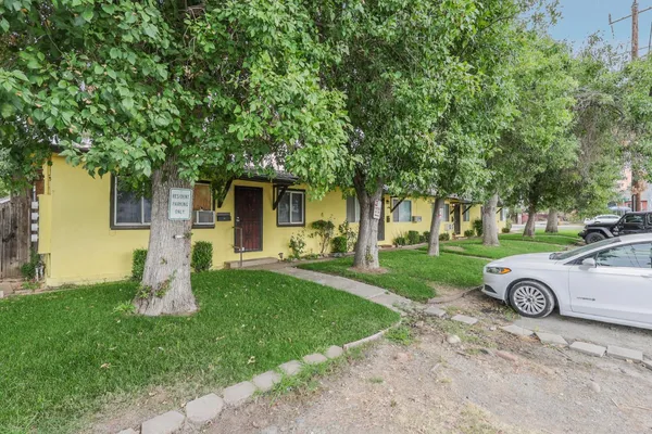 front view of a house with a yard