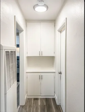 a view of walk in closet with empty racks