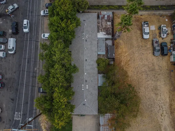 an aerial view of a house with outdoor space