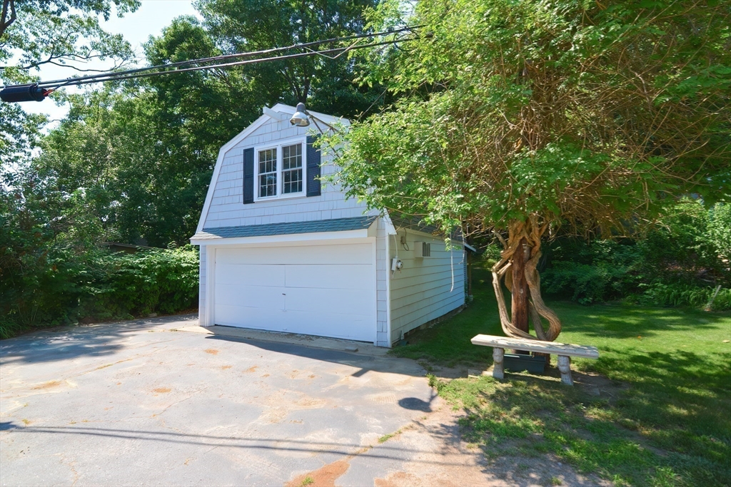 64 Pine Point Road Stow, MA 01775 - Photo 12 of 35 a front view of a house with a yard
