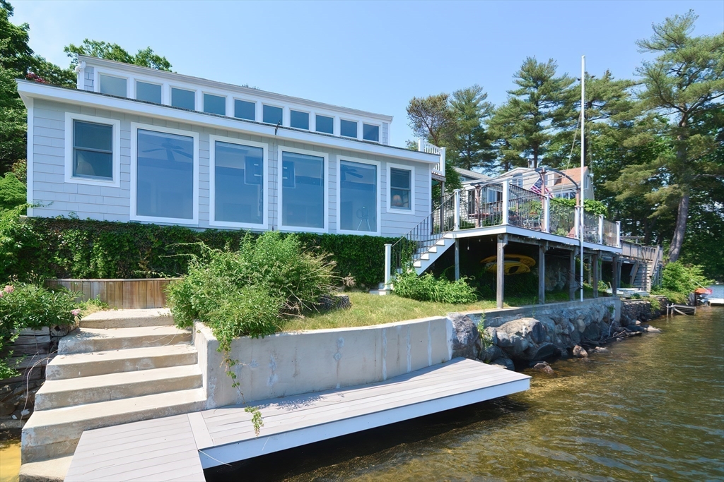64 Pine Point Road Stow, MA 01775 - Photo 6 of 35 a view of a house with swimming pool next to a yard