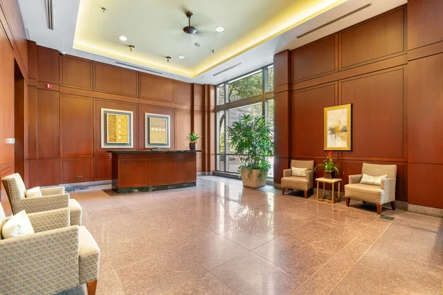 a view of a livingroom with furniture and windows