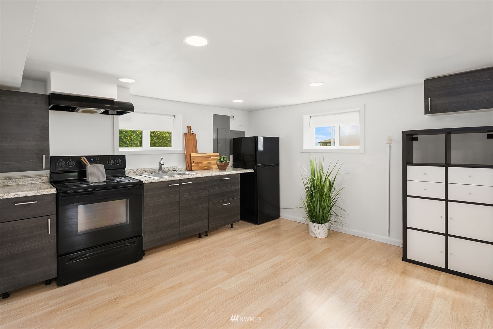 806 Cedar Avenue South Renton, WA 98057 - Photo 14 of 20 a kitchen with stainless steel appliances kitchen island granite countertop a refrigerator a sink a stove a microwave a counter space and cabinets