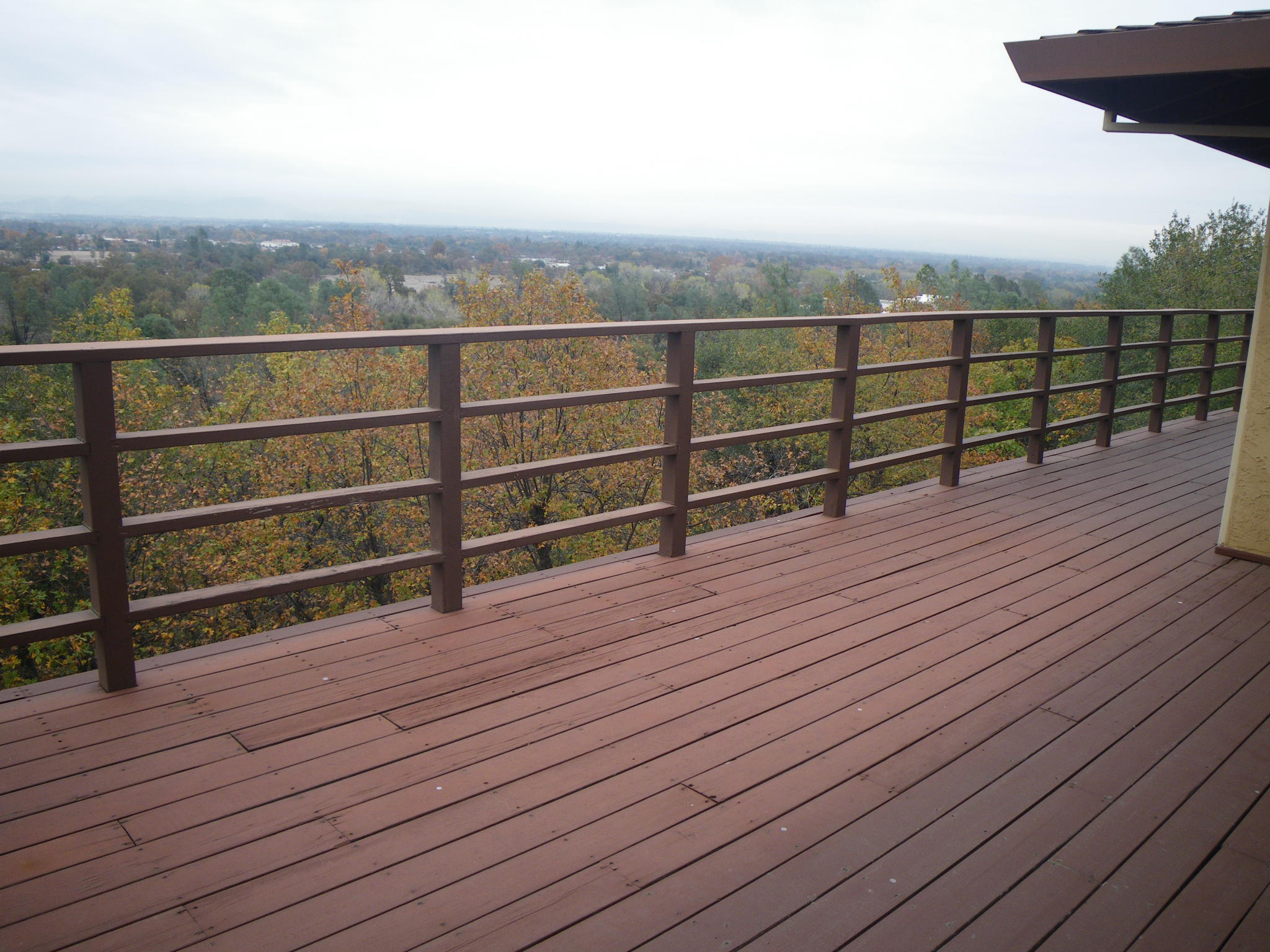8815 Valley View Road Redding, CA 96001 - Photo 19 of 25 a view of a terrace with wooden floor and fence