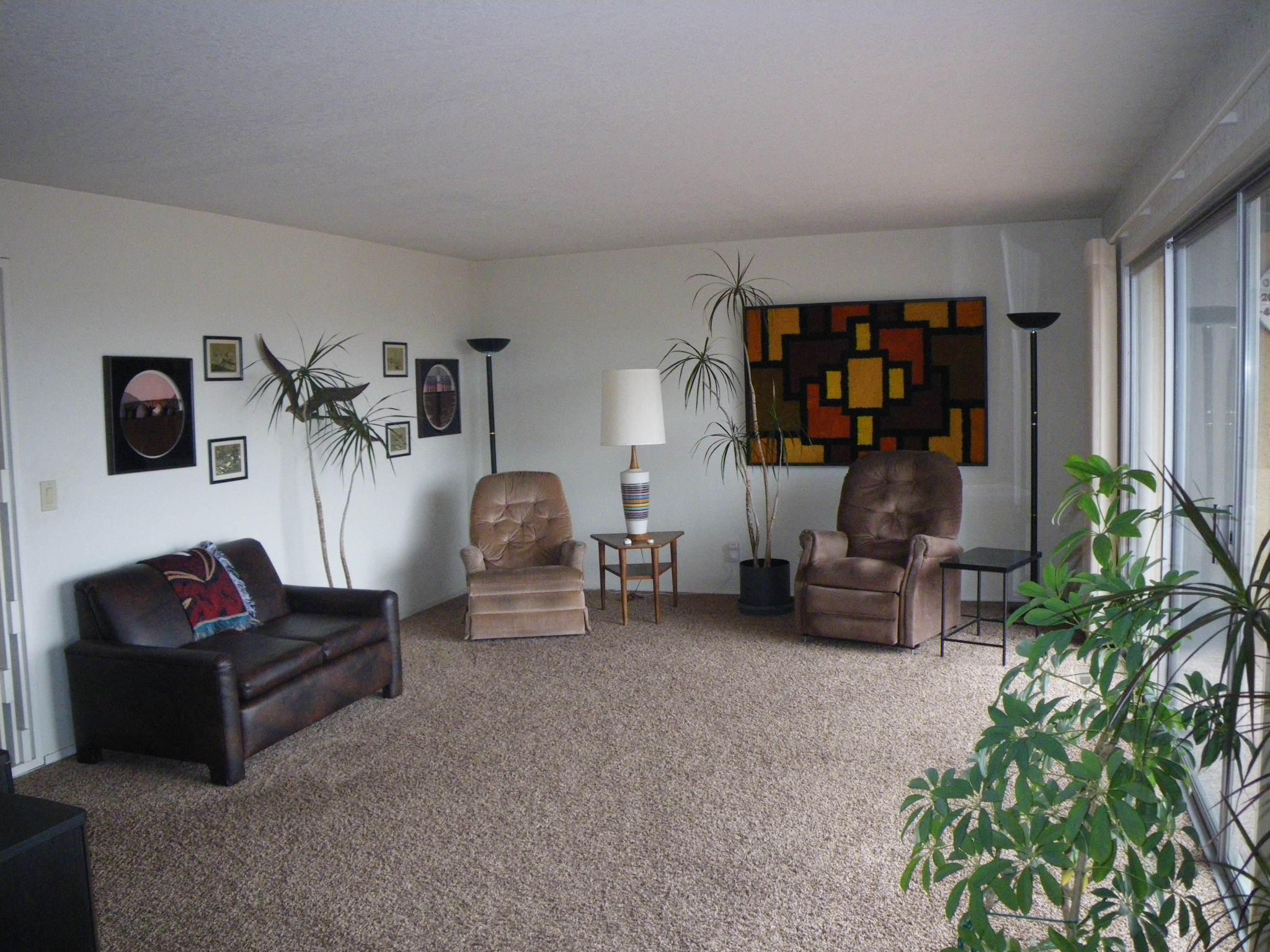 8815 Valley View Road Redding, CA 96001 - Photo 3 of 25 a living room with furniture and a potted plant