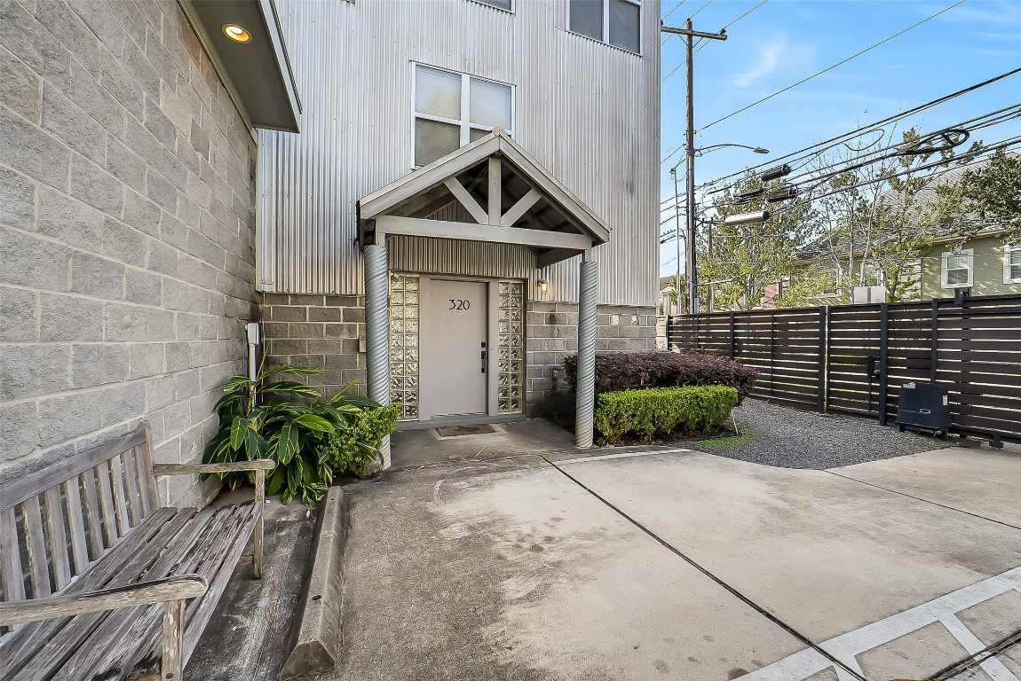 320 Detering Street Houston, TX 77007 - Photo 2 of 32 Exterior view of the residence, located on the right side of the adjacent unit. Two dedicated parking spaces sit directly in front for convenient, private access. Secure, gated entrance, located in the heart of the Rice Military area. Trash, pool/yard maintenance are included!
