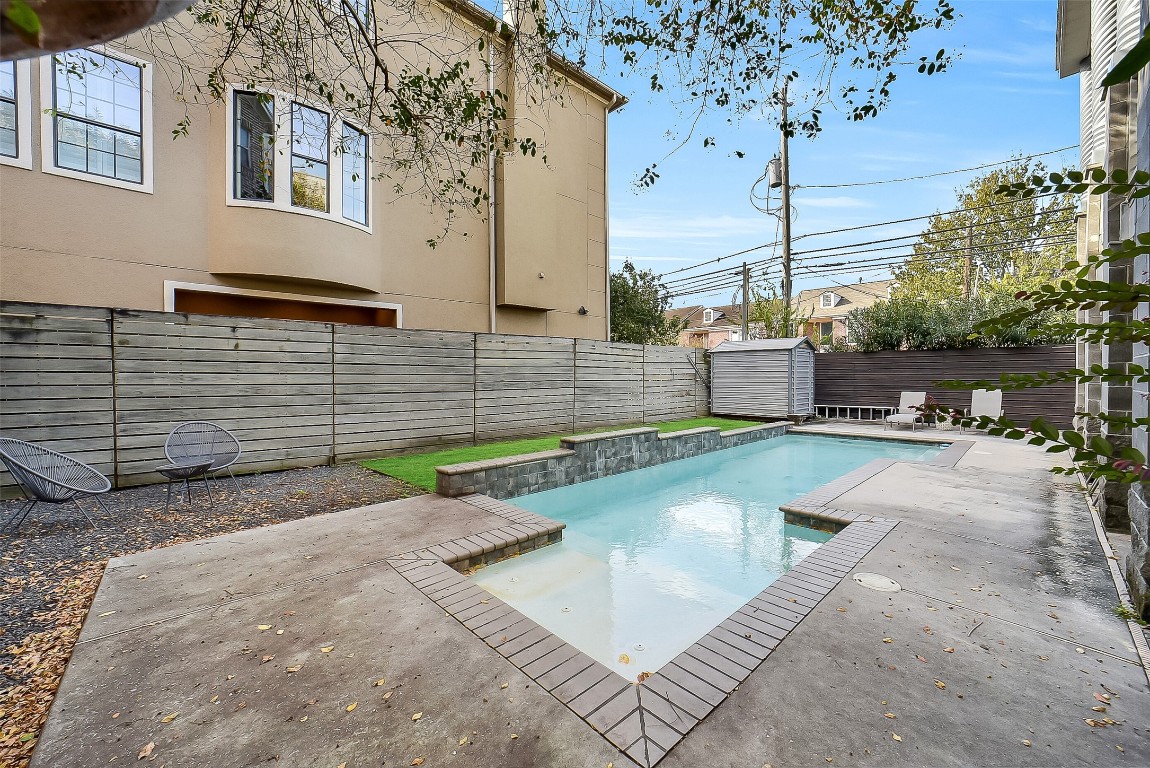 320 Detering Street Houston, TX 77007 - Photo 26 of 32 Another view of the fully enclosed backyard. Wood privacy fence, providing a secure and secluded outdoor space. Multiple seating areas for relaxing or entertaining, including the gravel seating area and patio space. Wonderful pool; ideal for those hot summer days in Houston!
