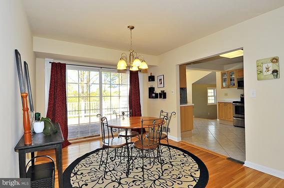 a dining room with furniture window wooden floor