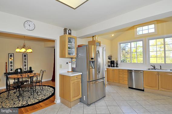 15310 Riding Stable Road Laurel, MD 20707 - Photo 13 of 27 a kitchen with refrigerator and table