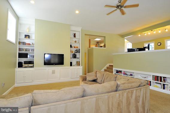 15310 Riding Stable Road Laurel, MD 20707 - Photo 14 of 27 a bedroom with a bed and a flat screen tv