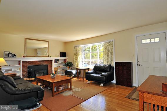 15310 Riding Stable Road Laurel, MD 20707 - Photo 15 of 27 a living room with furniture a fireplace and a window