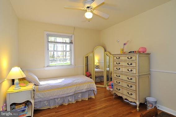 15310 Riding Stable Road Laurel, MD 20707 - Photo 17 of 27 a bedroom with a bed and a dresser