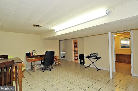 15310 Riding Stable Road Laurel, MD 20707 - Photo 18 of 27 a view of workspace with wooden floor and lounge chair