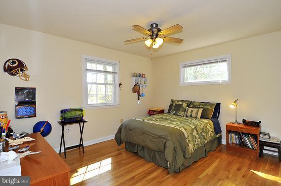 15310 Riding Stable Road Laurel, MD 20707 - Photo 3 of 27 a bedroom with a bed and a window