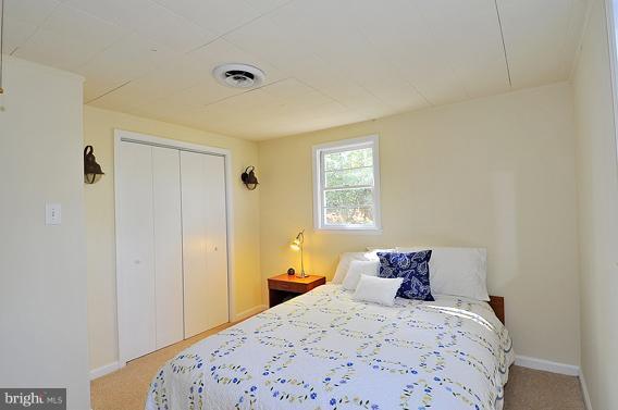 15310 Riding Stable Road Laurel, MD 20707 - Photo 21 of 27 a bedroom with a bed and a window