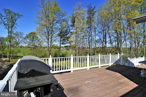 15310 Riding Stable Road Laurel, MD 20707 - Photo 26 of 27 a view of a wooden deck and a backyard