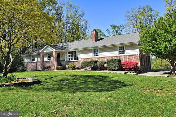 15310 Riding Stable Road Laurel, MD 20707 - Photo 27 of 27 a front view of house with yard and green space