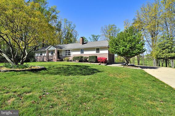 15310 Riding Stable Road Laurel, MD 20707 - Photo 6 of 27 a front view of house with yard and green space