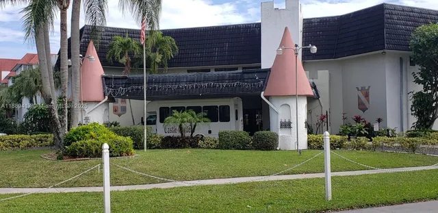 an entryway with table and chairs