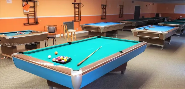 a view of a house with backyard porch and sitting area